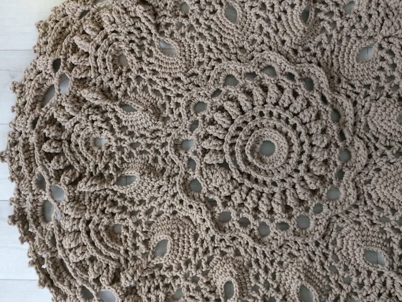 An intricate and beautiful brown circular macrame piece